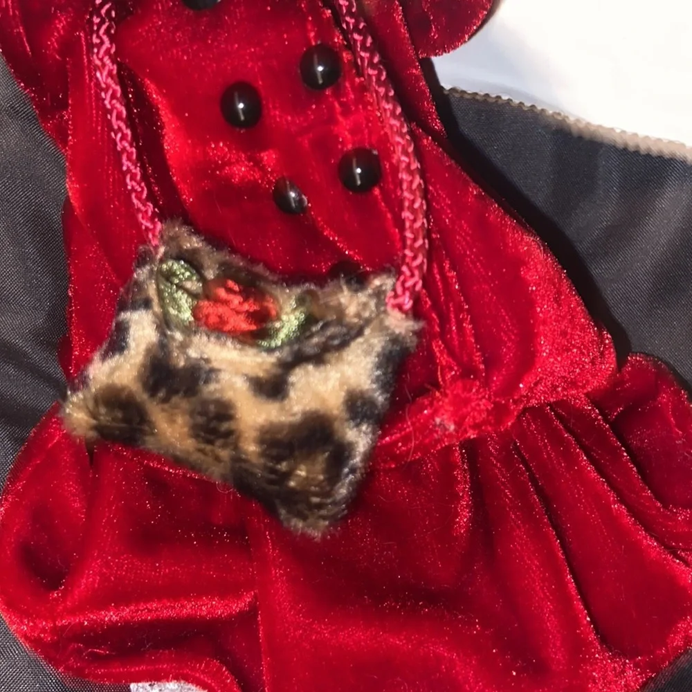 Vintage African American doll ornament with red velvet and leopard fur purse